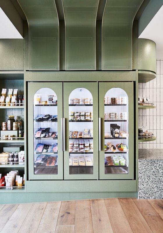 The fridge cabinet inside the shop, with its three arched doors.