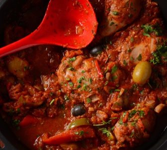 chicken cacciatore with bell peppers, tomatoes, black olives. italian food