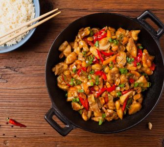chicken kung pao. fried chicken pieces with peanuts and peppers.
