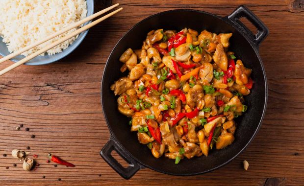 chicken kung pao. fried chicken pieces with peanuts and peppers.