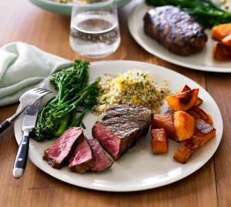 charred beef sirloin pumpkin broccolini and herb couscous