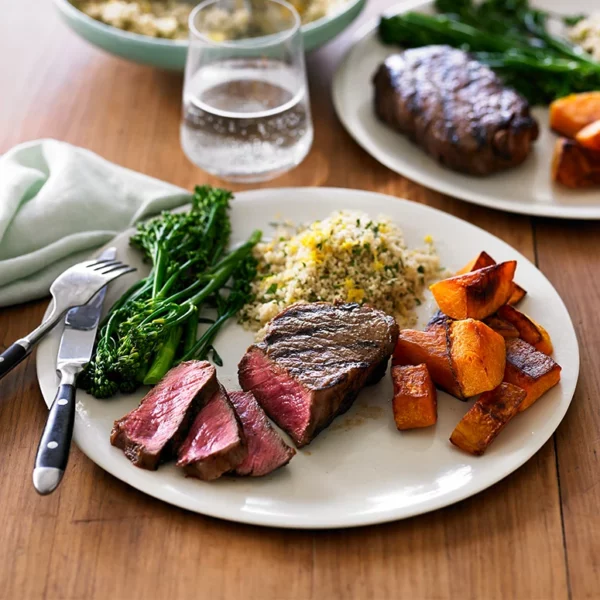 charred beef sirloin pumpkin broccolini and herb couscous